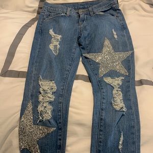 Carmar blue denim jeans for sale. Size 24 with two star rhinestone patches.